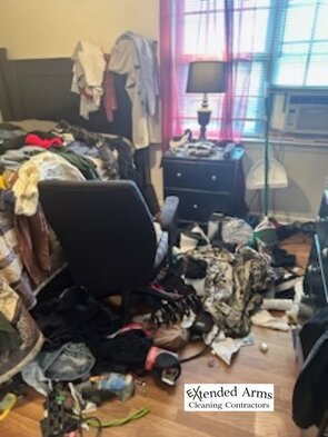 Dysfunctional bedroom full of trash, clothes and clutter. Clutter control service memphis tennessee